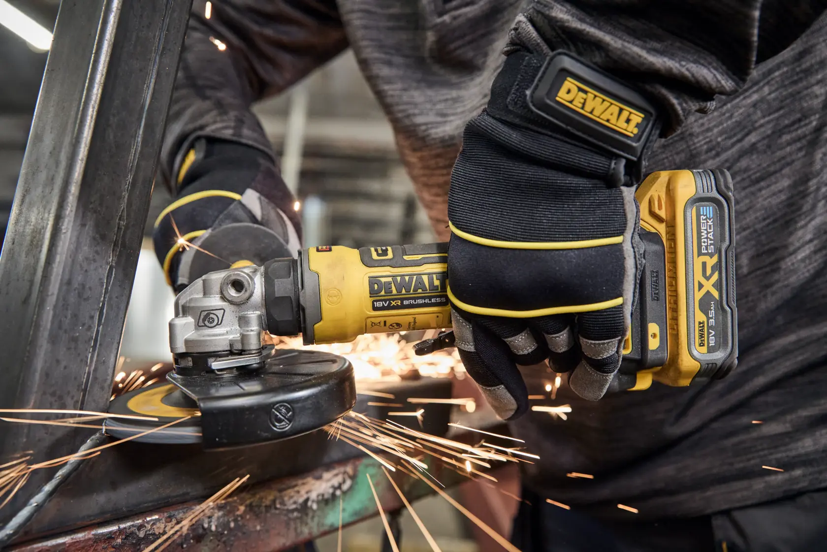 DEWALT DCG404S2T-QW, DCG404S2T grinder in use, sparks flying during metalwork. Photography product category.