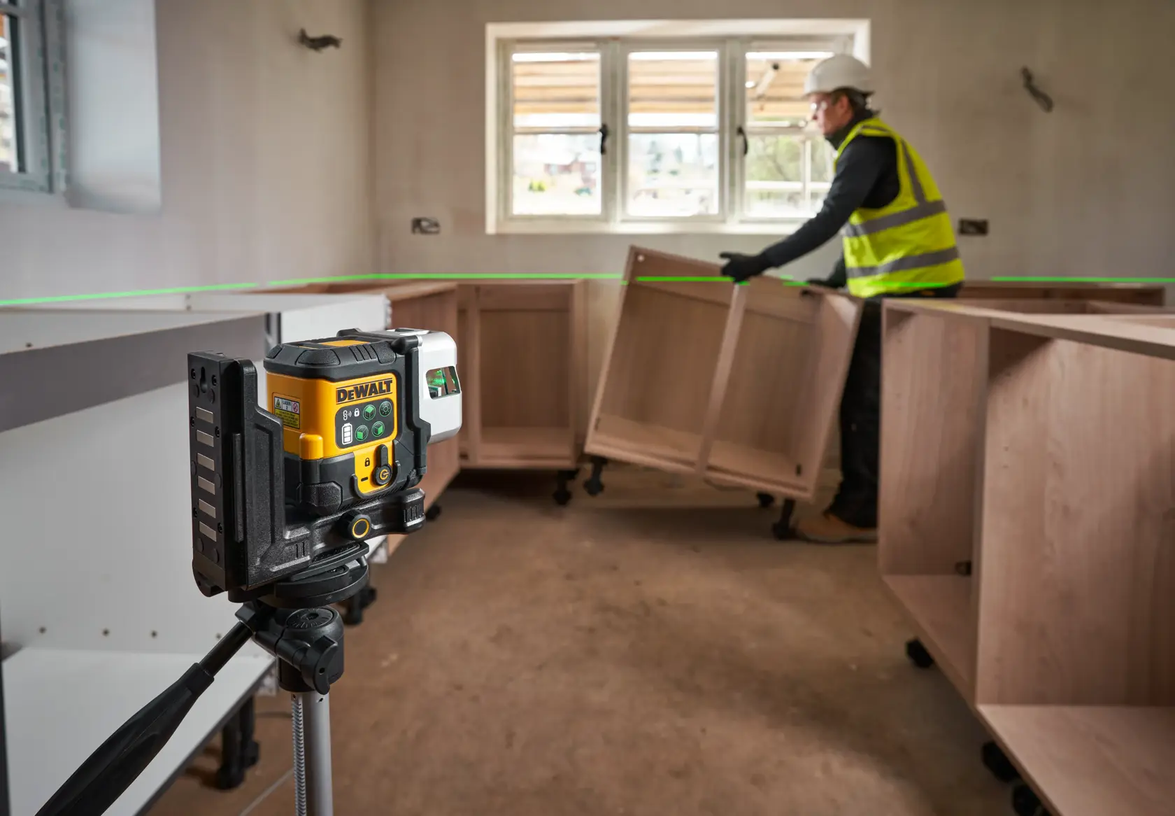 DEWALT laser level kit with a black carrying case, a yellow and black laser level device, a yellow USB cable, and a metal ruler, all displayed together.