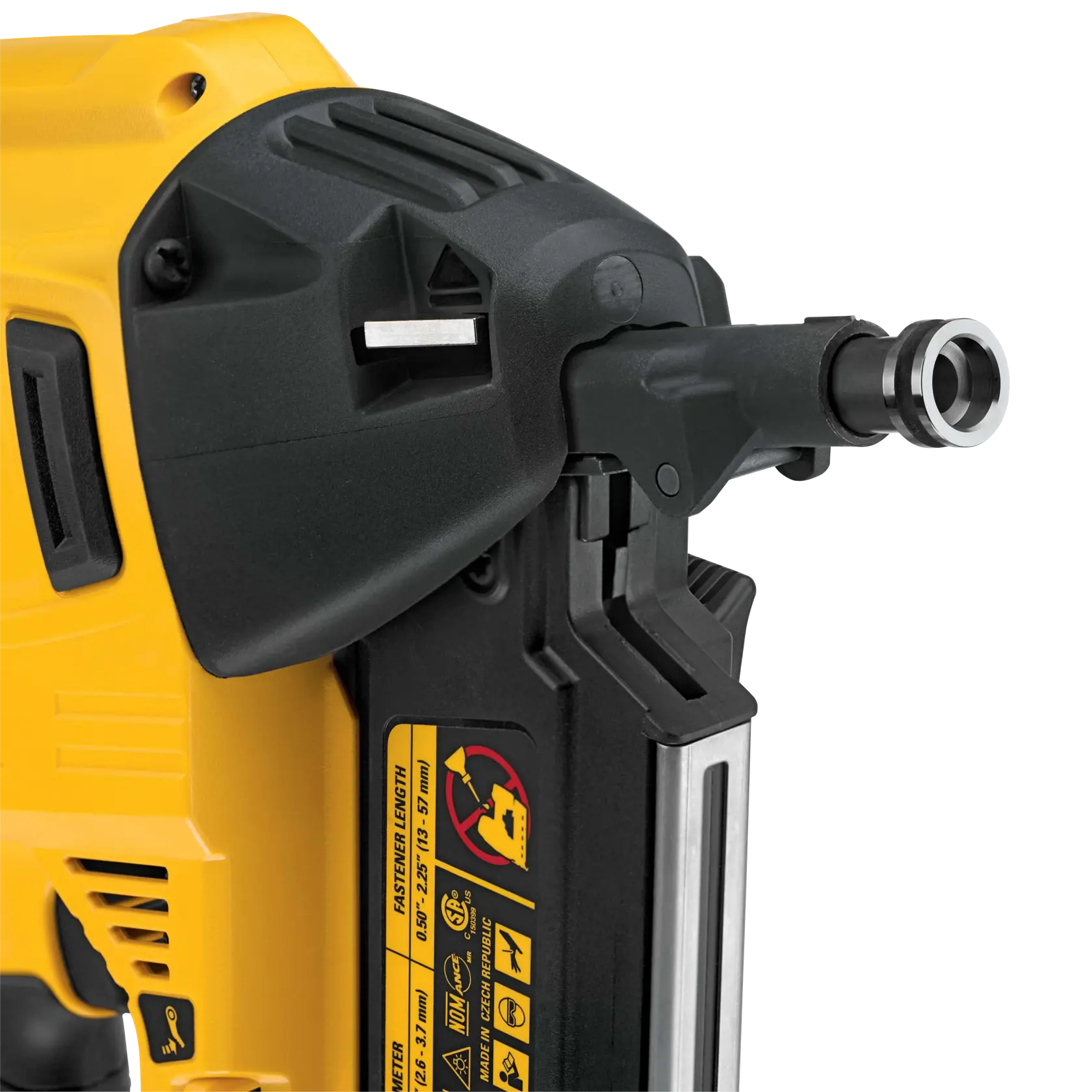 Close-up of a DEWALT nail gun showing safety labels and part of the barrel.