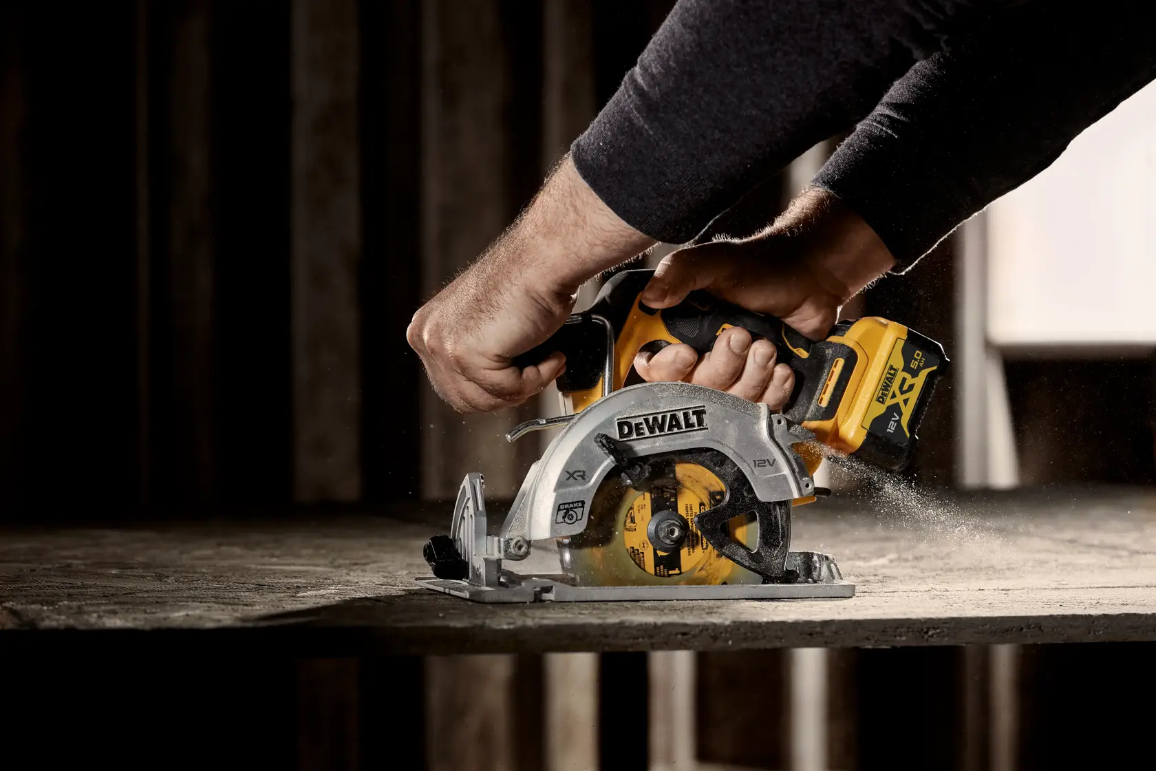 DEWALT circular saw in use, DCS512P2-QW and DCS512P2 SKUs, shown cutting wood in a workshop.