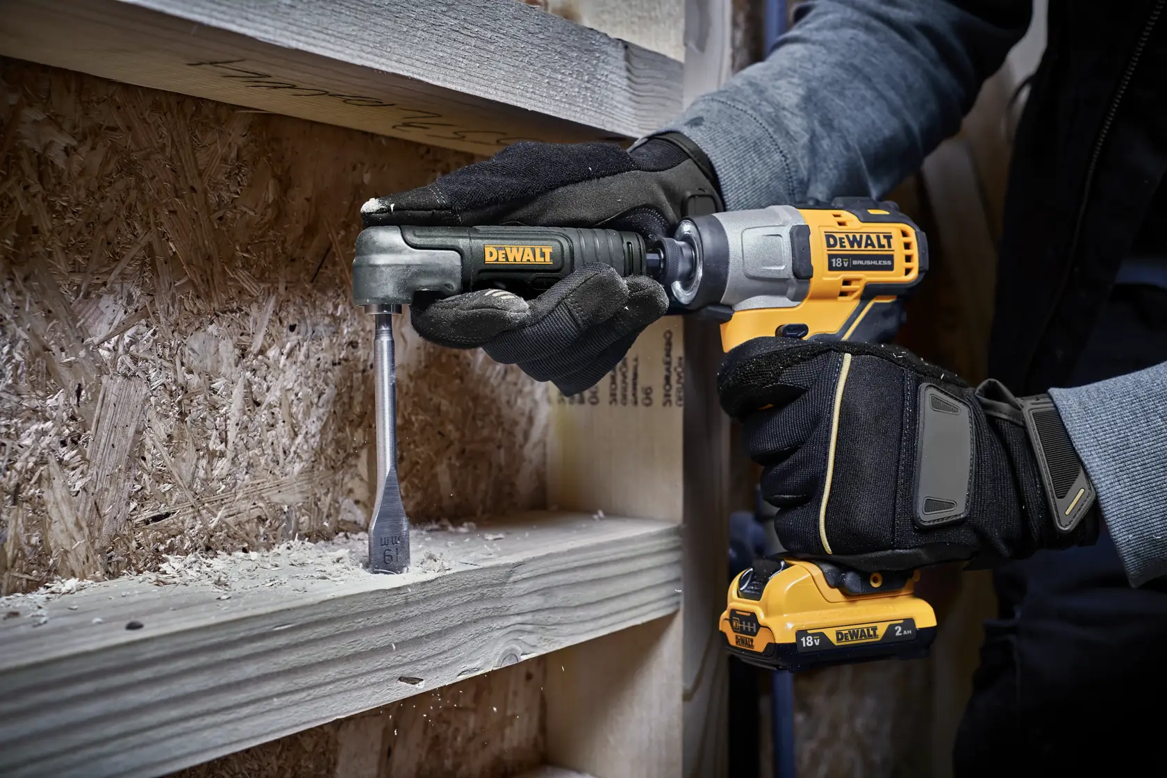 Person drills wood using a DEWALT DT20500 drill attachment and cordless driver.