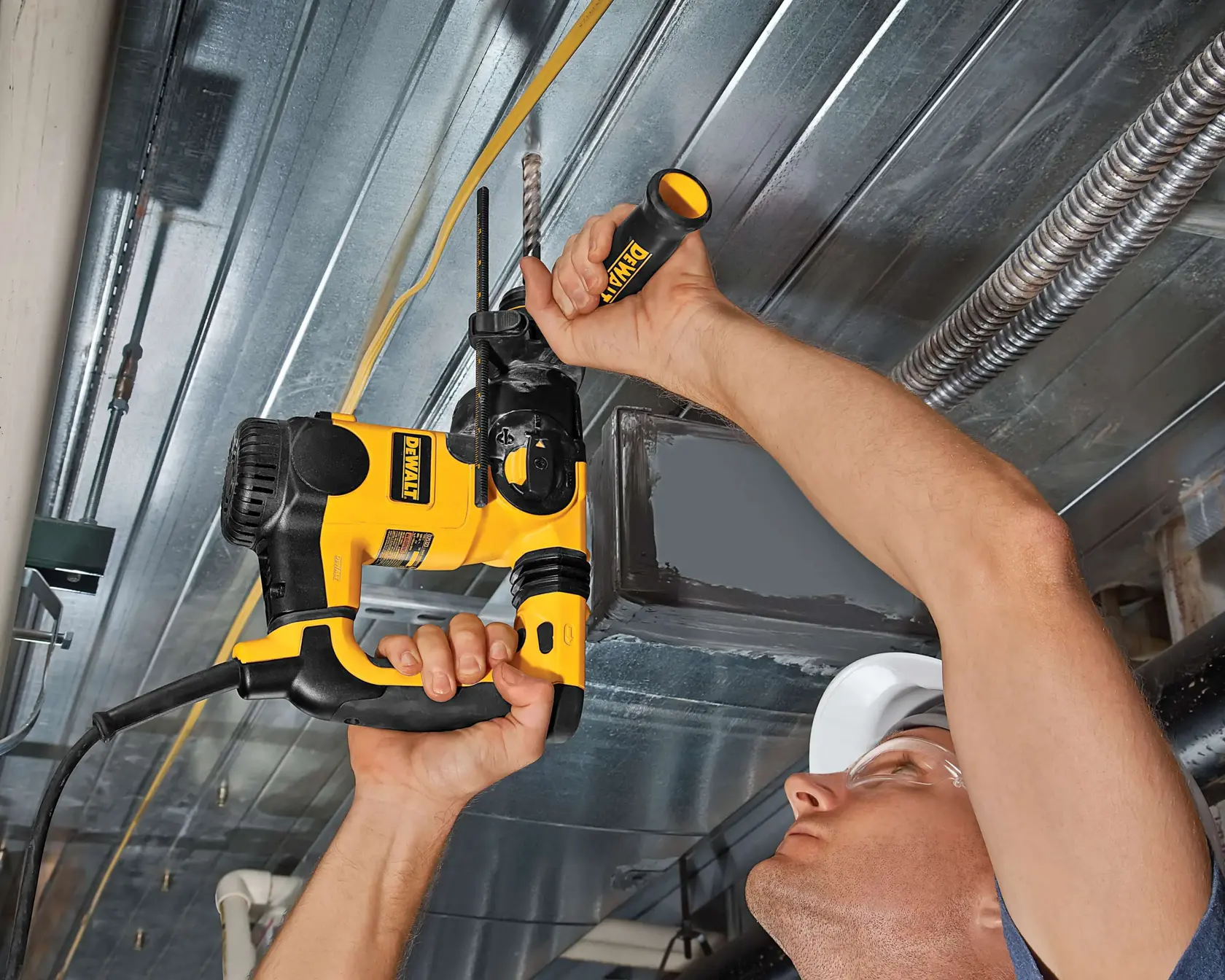 DEWALT DT9541, DT9541-QZ drill in use drilling metal ceiling. Product category: Photography.